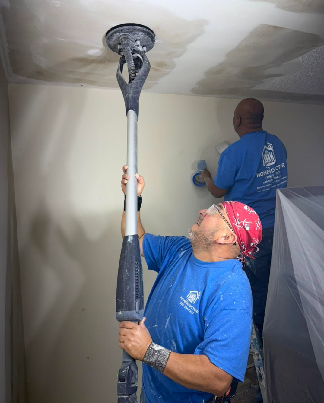 Home Doctor Construction team performing popcorn ceiling removal and ceiling refinishing