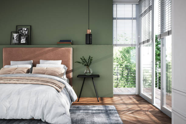 Freshly painted bedroom walls in a modern sage green finish by a painting company in Clemmons, NC