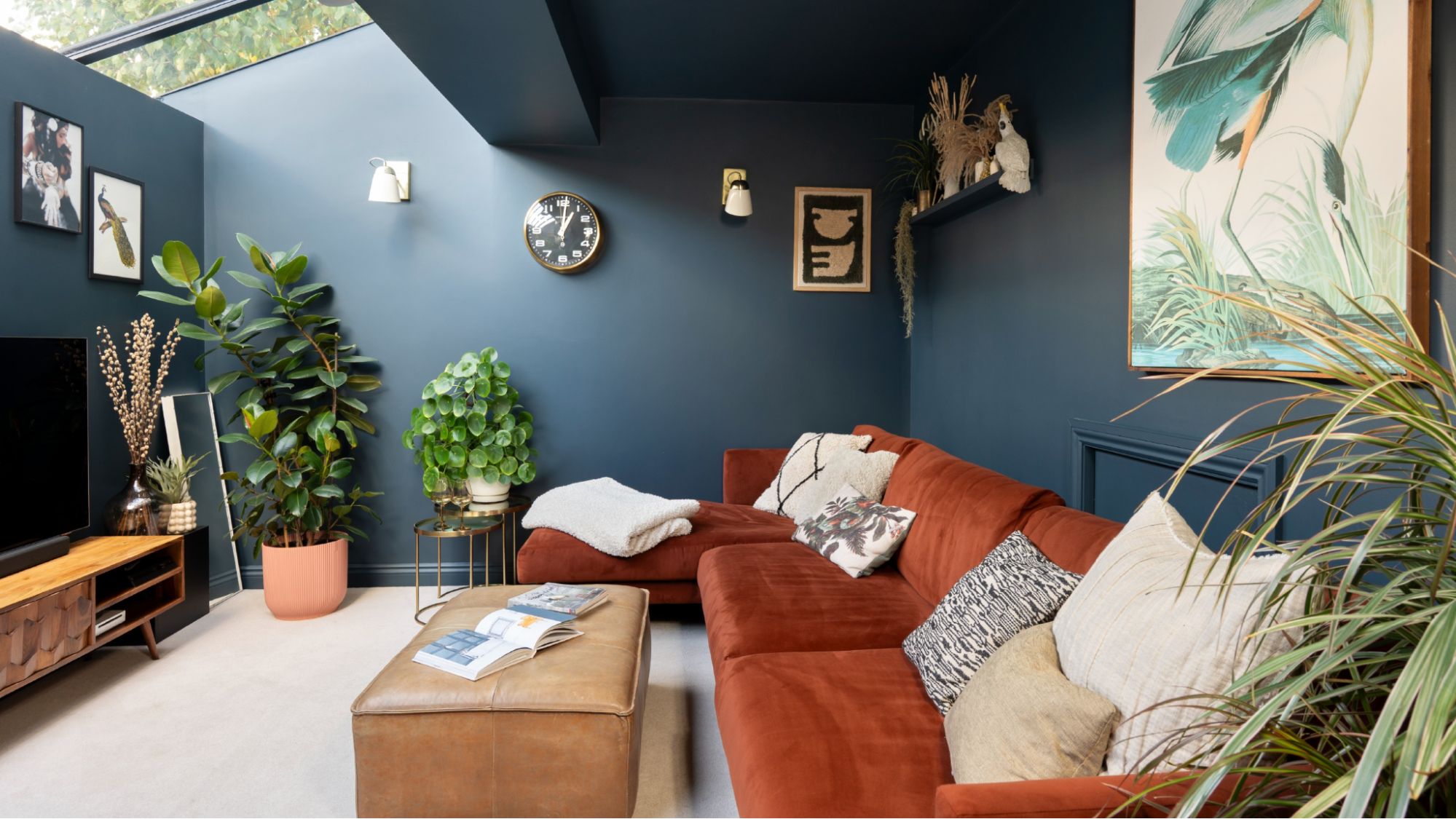 Modern living room with dark blue painted walls and trim by an interior painter in Summerfield, NC