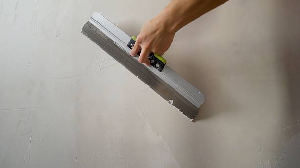 Professional skim coating and drywall finishing for a smooth, seamless wall surface by a house painter in Kernersville, NC